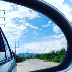 View of road against cloudy sky