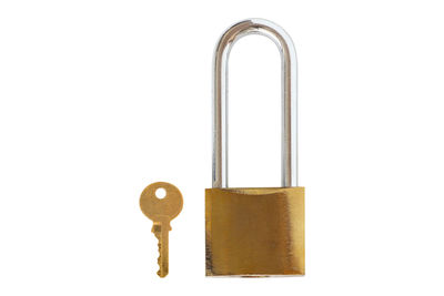 Close-up of padlocks against white background