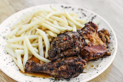 Close-up of burger with meat and fries