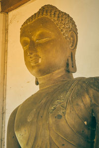 Close-up of statue against temple