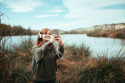 Woman photographing with smart phone