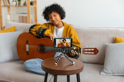 Young woman playing guitar