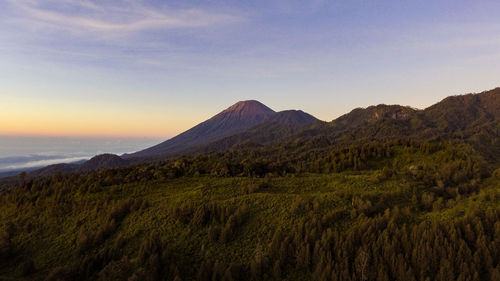 Scenic view of landscape against sky during sunset