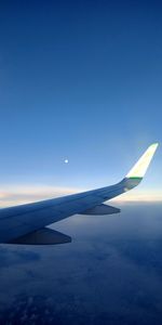 Airplane flying over blue sky