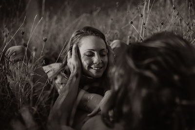 Portrait of smiling young woman on field