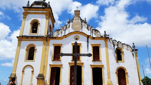 Low angle view of cathedral against cloudy sky