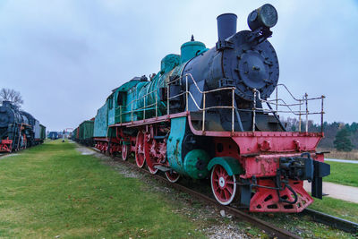 Train on field against sky