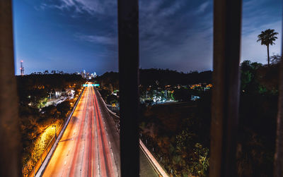 Panoramic view of road in city at dusk