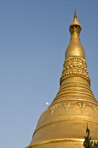 Low angle view of temple against clear blue sky