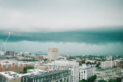 High angle view of buildings in city against sky