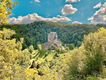View of castle on landscape against sky