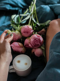 Coffee and peonies in bed