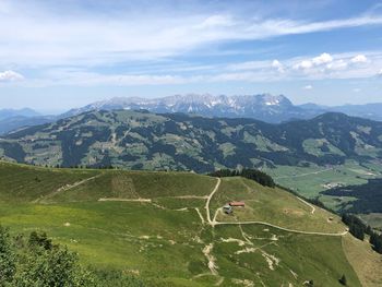 Scenic view of landscape and mountains against sky