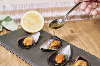 Close-up of person preparing food on table