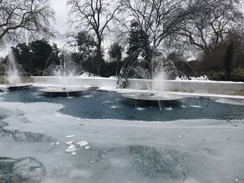 Scenic view of frozen lake against sky during winter