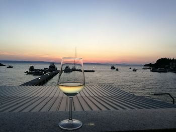 Scenic view of sea against clear sky during sunset