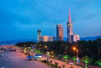 Illuminated buildings in city at night