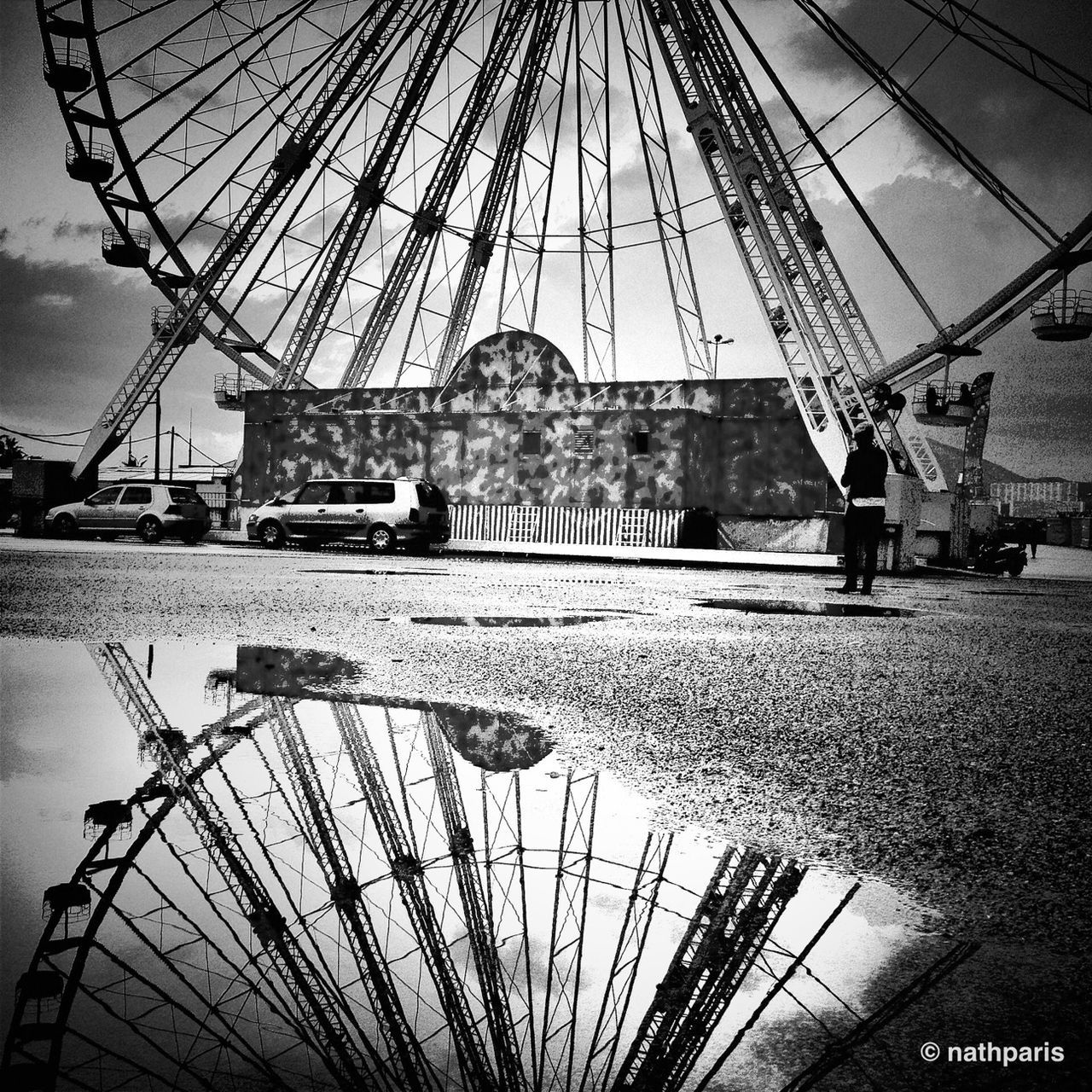 leisure activity, lifestyles, men, sky, amusement park, amusement park ride, travel, built structure, arts culture and entertainment, ferris wheel, transportation, architecture, famous place, tourism, person, travel destinations, large group of people, cloud - sky, international landmark