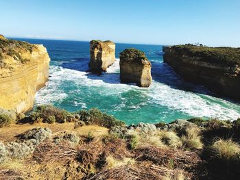 Scenic view of sea against clear blue sky