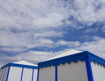 Low angle view of house on building against sky