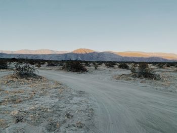 Scenic view of desert against clear sky