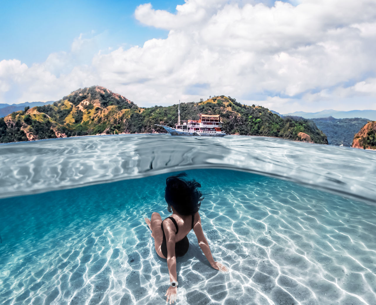 WOMAN IN SWIMMING POOL