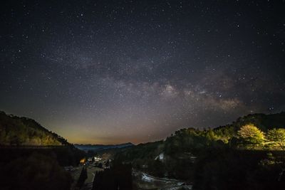 Scenic view of star field against sky at night