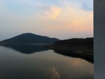 Scenic view of lake against sky during sunset