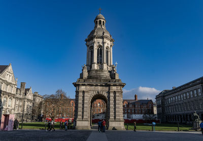 Low angle view of historic building against clear blue sky