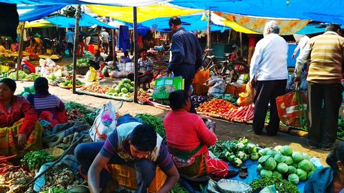 People at market stall