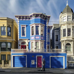 Buildings against blue sky in city