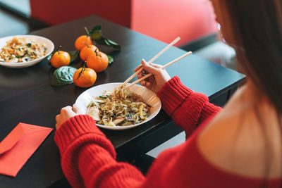 Midsection of woman having food