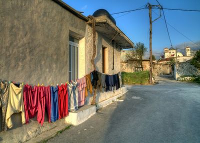 Clothes drying on clothesline against building