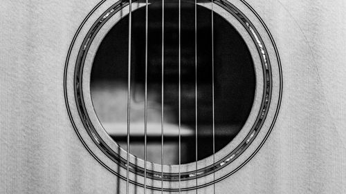 Close-up of guitar on wall