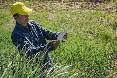 Side view of man working on field