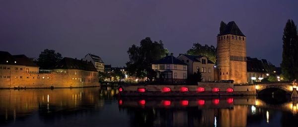 Illuminated buildings at waterfront