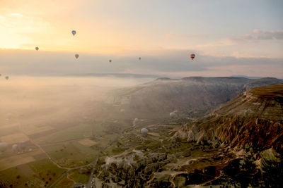 Aerial view of landscape against sky during sunset