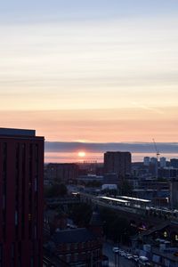 High angle view of buildings against sky during sunset