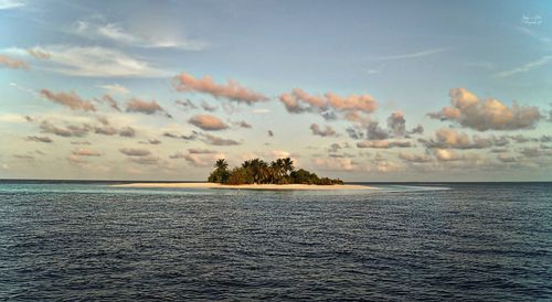 Scenic view of sea against sky at sunset