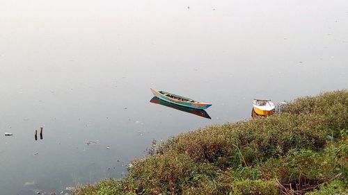 High angle view of boats moored in lake