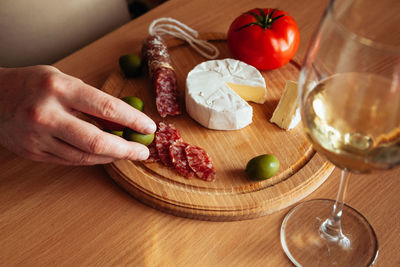 High angle view of person preparing food on cutting board