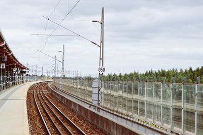 Railroad station platform against sky