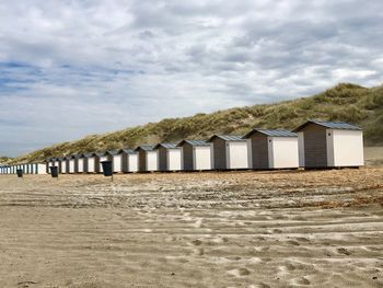 Built structure on beach against sky