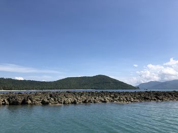 Scenic view of sea against blue sky