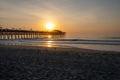 Scenic view of sea against sky during sunrise