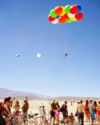 People paragliding in sky