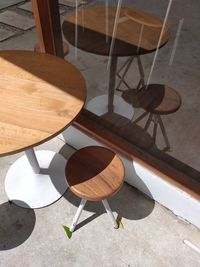 High angle view of empty chairs on table