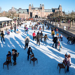 High angle view of people on snow covered landscape