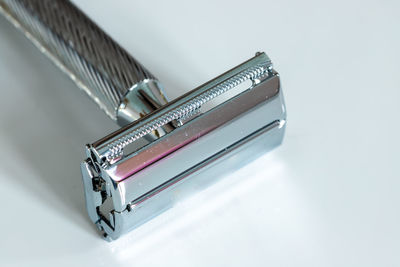 High angle view of piano on table against white background