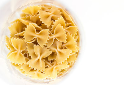 High angle view of uncooked pasta in plate on table